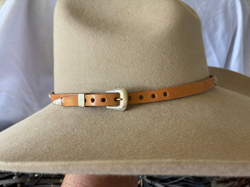 Adjustable tan leather hatband w/ silver 
Conchos & buckle