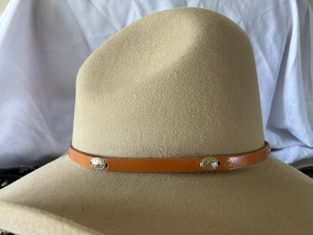 Adjustable tan leather hatband w/ silver 
Conchos & buckle